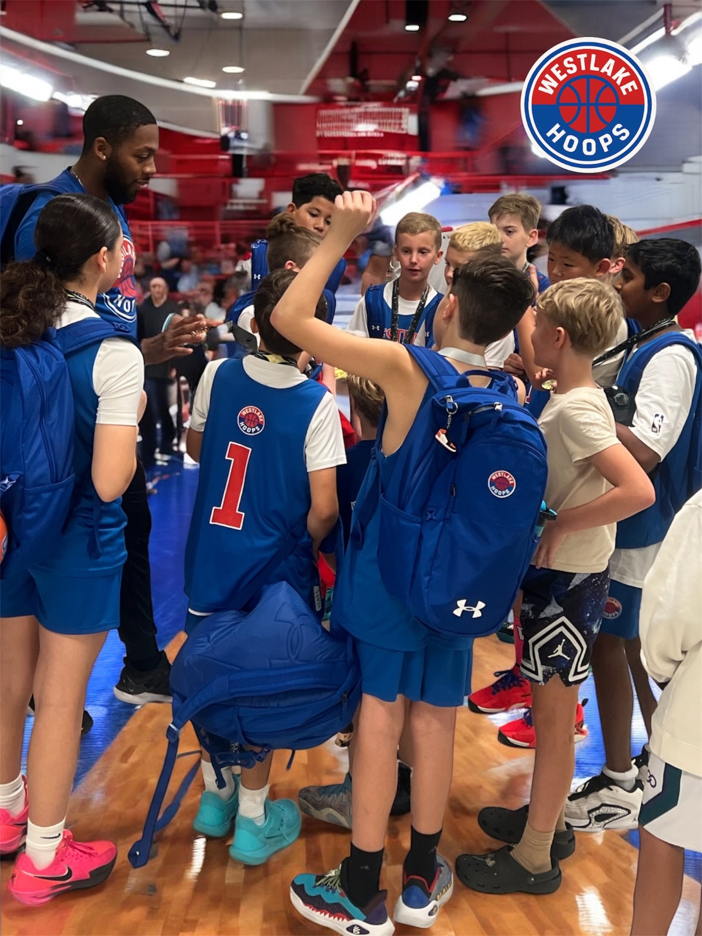 Team huddle inside the arena.
